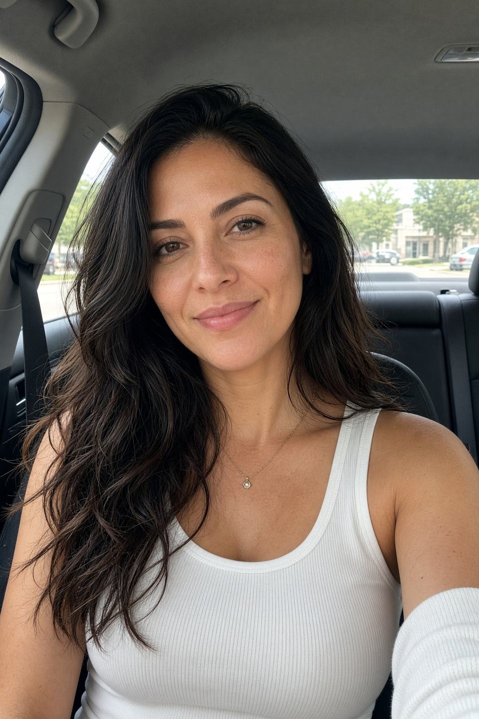 Car selfie in a tank top